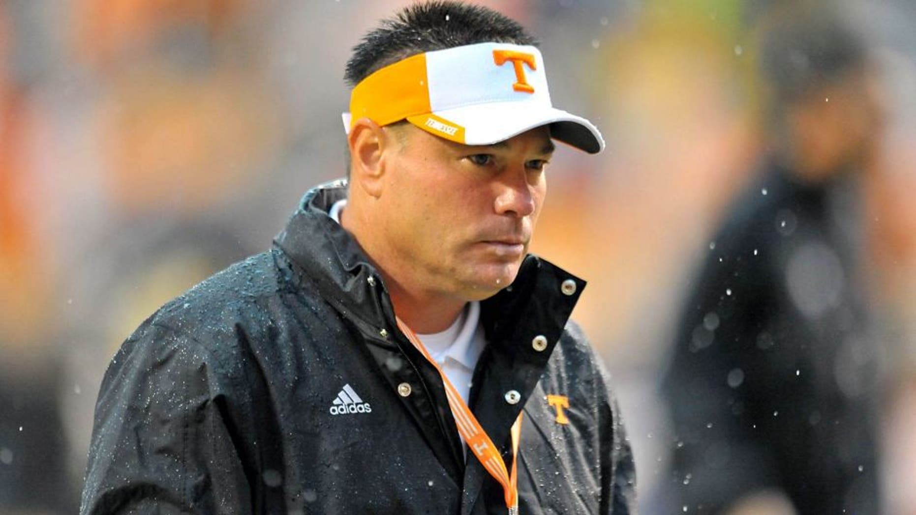 Aug 31, 2014; Knoxville, TN, USA; Tennessee Volunteers head coach Butch Jones leaves the field after warm ups prior to the game against the Utah State Aggies at Neyland Stadium. Mandatory Credit: Jim Brown-USA TODAY Sports