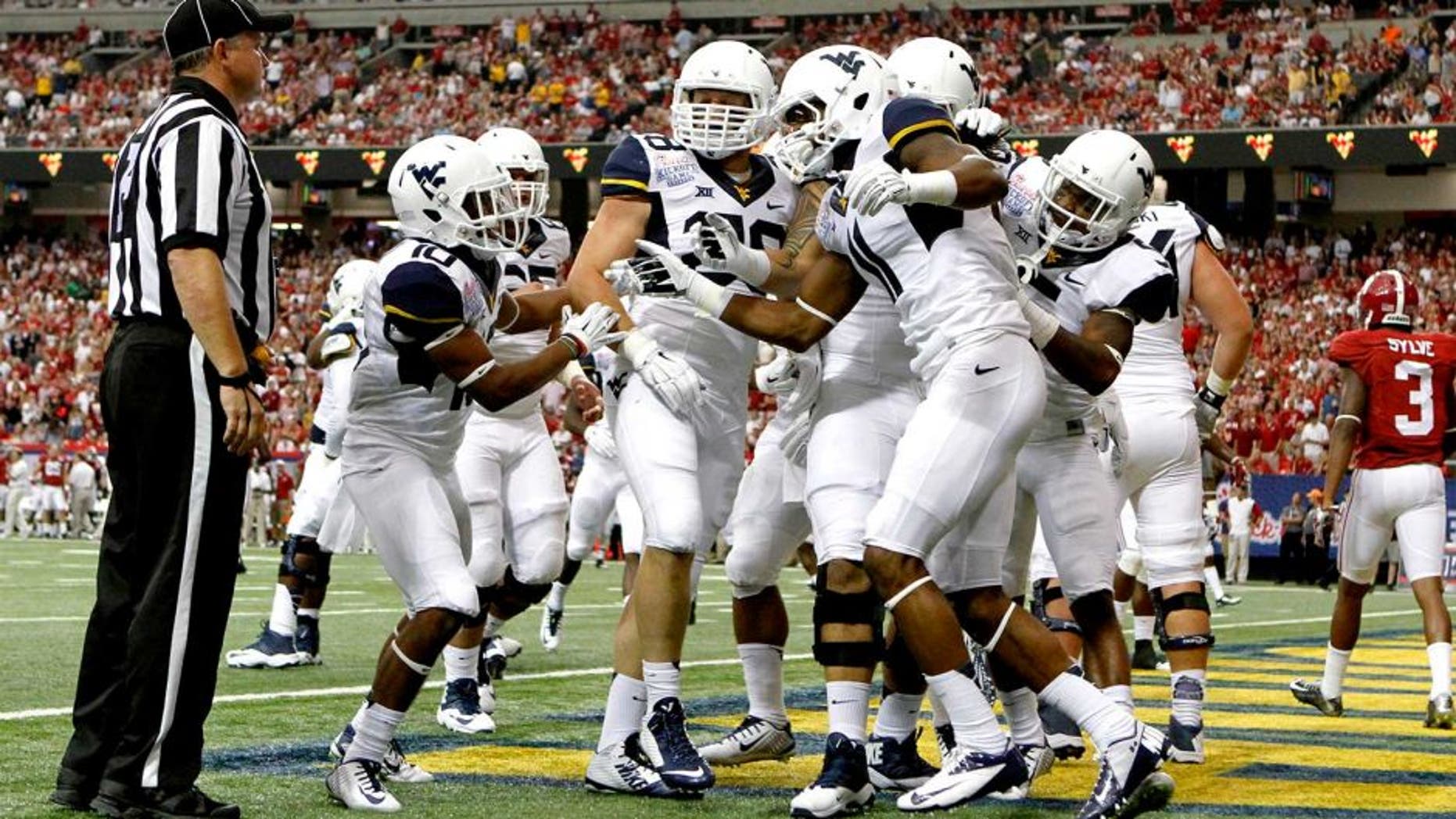 Aug 30, 2014; Atlanta, GA, USA; West Virginia Mountaineers wide receiver Kevin White (11) celebrates his touchdown catch against the Alabama Crimson Tide with teammates in the second quarter of the 2014 Chick-fil-A Kickoff Game at the Georgia Dome. Mandatory Credit: Brett Davis-USA TODAY Sports
