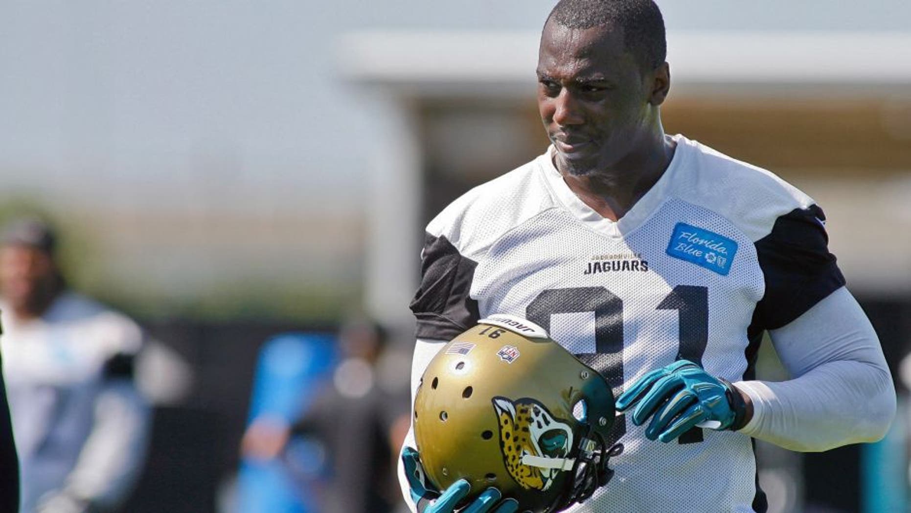 Jun 16, 2015; Jacksonville, FL, USA; Jacksonville Jaguars defensive end Chris Clemons (91) during minicamp at the Florida Blue Health and Wellness Practice Fields. Mandatory Credit: Phil Sears-USA TODAY Sports