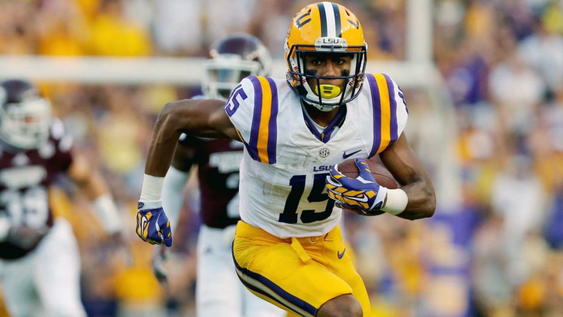 Sep 20, 2014; Baton Rouge, LA, USA; LSU Tigers wide receiver Malachi Dupre (15) runs after a catch against the Mississippi State Bulldogs during the first half of a game at Tiger Stadium. Mandatory Credit: Derick E. Hingle-USA TODAY Sports