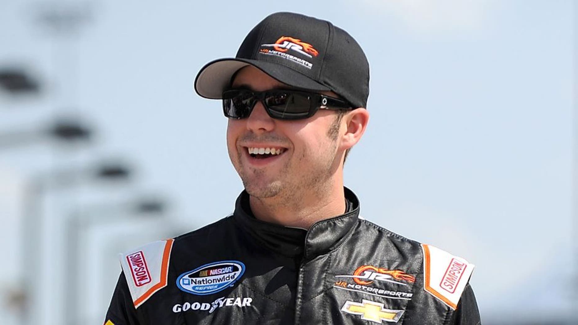 NEWTON, IA - AUGUST 02: Josh Berry, driver of the #5 Tackle Gab Chevrolet, stands on the grid during qualification for NASCAR Nationwide Series U.S. Cellular 250 Presented by New Holland at Iowa Speedway on August 2, 2014 in Newton, Iowa. (Photo by Jonathan Moore/Getty Images)