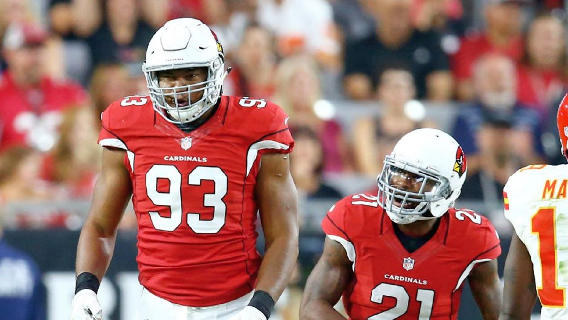 Aug 15, 2015; Glendale, AZ, USA; Arizona Cardinals defensive end Calais Campbell (93) celebrates a tackle with cornerback Patrick Peterson (21) in the first quarter against the Kansas City Chiefs in a preseason NFL football game at University of Phoenix Stadium. Mandatory Credit: Mark J. Rebilas-USA TODAY Sports
