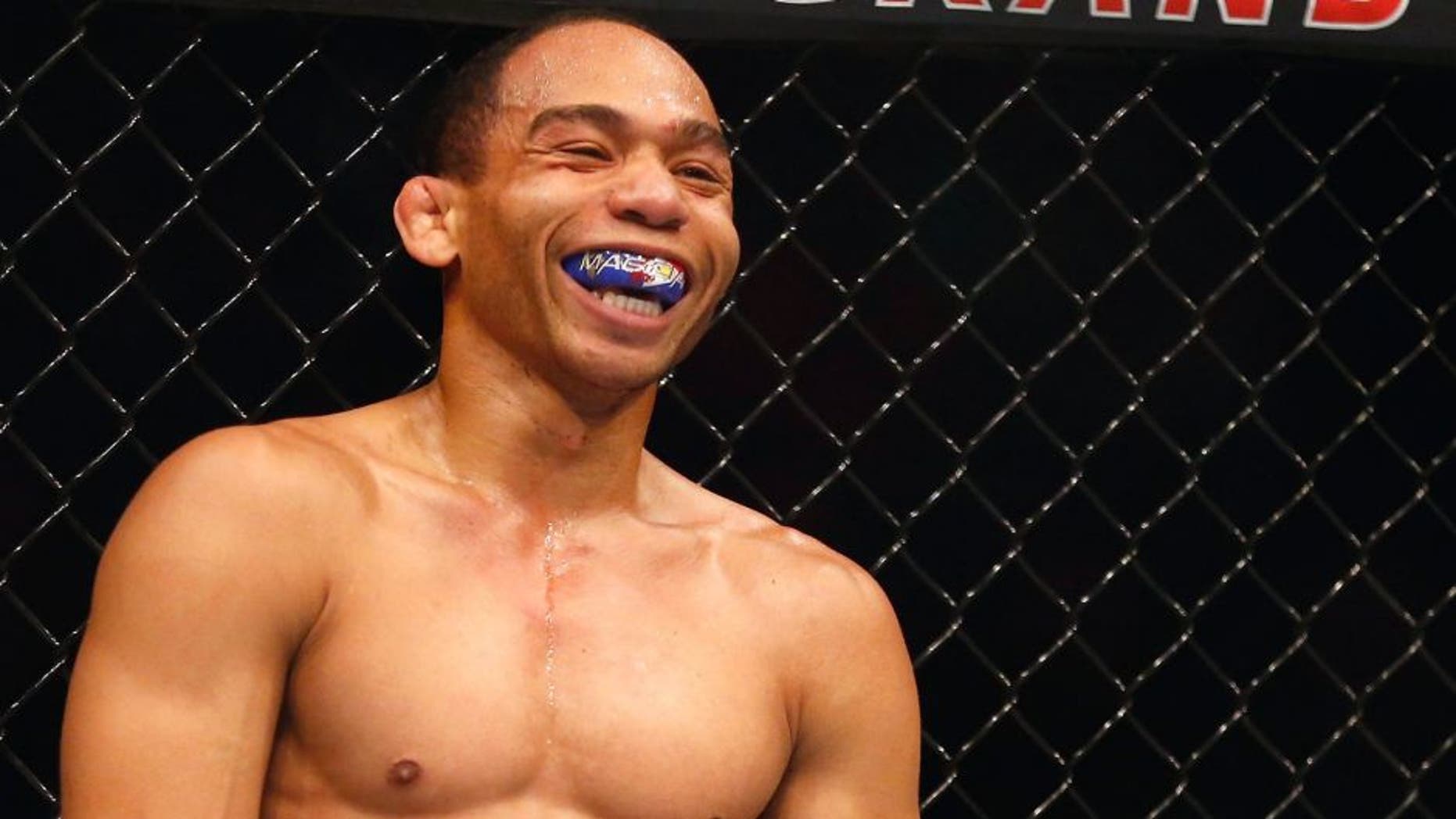 LAS VEGAS, NV - MAY 23: John Dodson laughs in between rounds during the UFC 187 event at the MGM Grand Garden Arena on May 23, 2015 in Las Vegas, Nevada. (Photo by Christian Petersen/Zuffa LLC/Zuffa LLC via Getty Images)