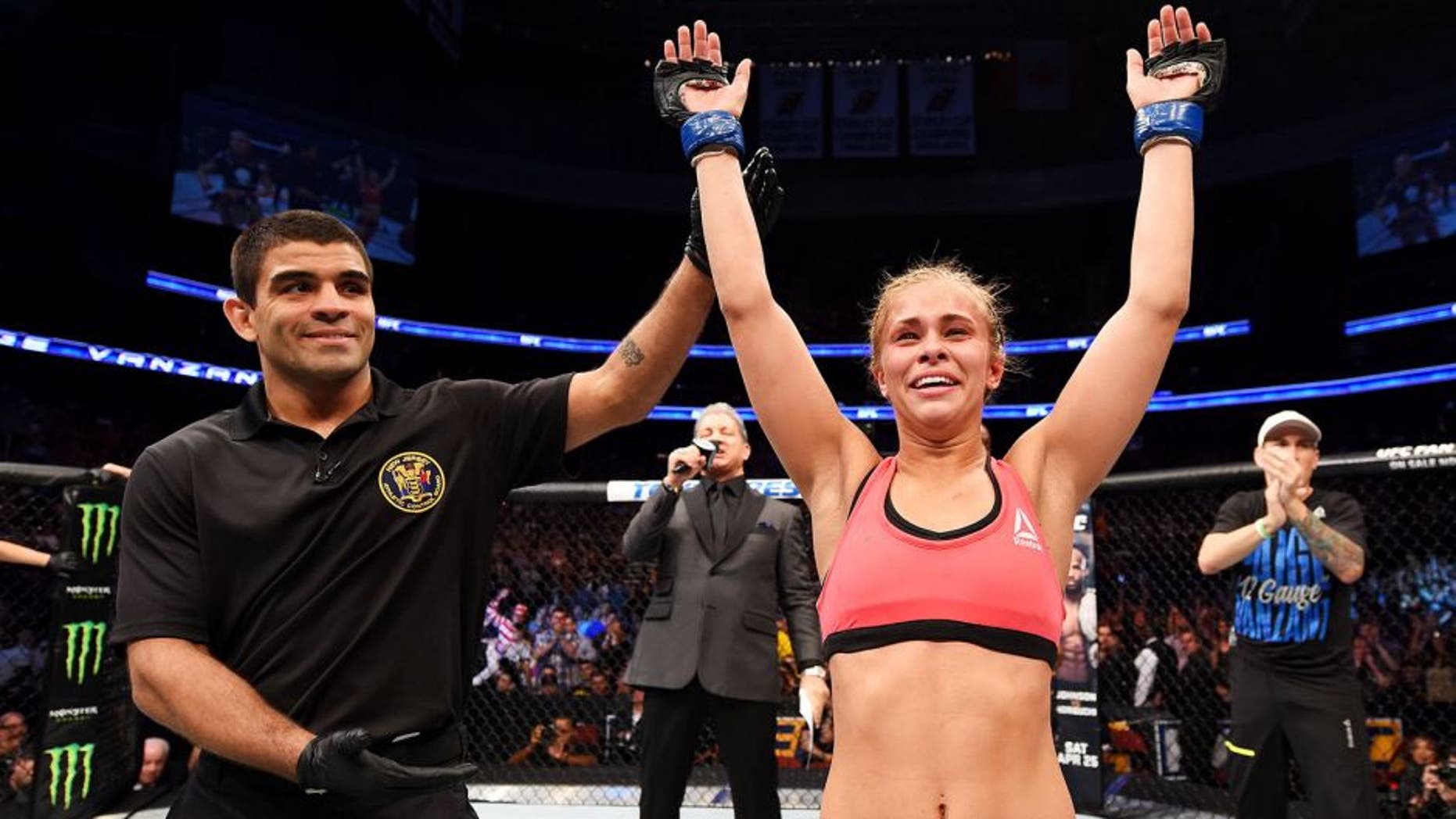 NEWARK, NJ - APRIL 18: Paige VanZant celebrates defeating Felice Herrig in their women's strawweight bout during the UFC Fight Night event at Prudential Center on April 18, 2015 in Newark, New Jersey. (Photo by Josh Hedges/Zuffa LLC/Zuffa LLC via Getty Images)