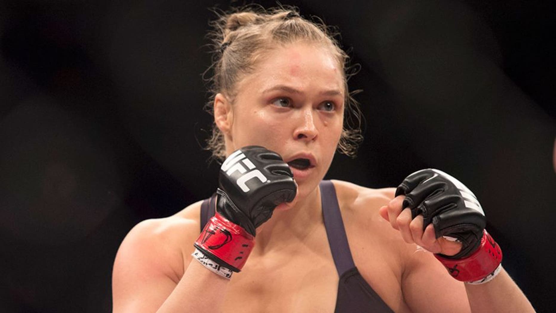 RIO DE JANEIRO, BRAZIL - AUGUST 01: UFC women's bantamweight champion Ronda Rousey of the United States rushes forward against Bethe Correia of Brazil during the UFC 190 event inside HSBC Arena on August 1, 2015 in Rio de Janeiro, Brazil. (Photo by Jeff Bottari/Zuffa LLC/Zuffa LLC via Getty Images)