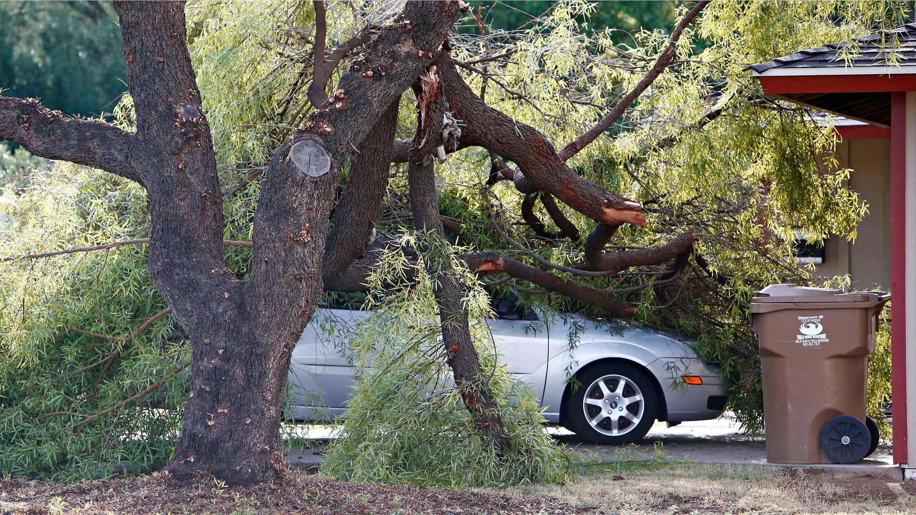 Sept. 1, 2015: A vehicle on Clarendon and 44th Street is damaged from fallen tree limbs.
