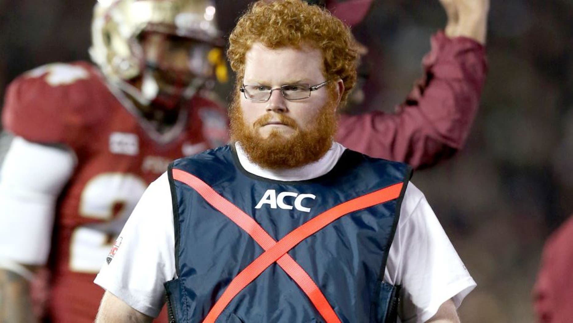 Jan 6, 2014; Pasadena, CA, USA; Florida State Seminoles ball boy assistant equipment manager Frankie Grizzle-Malgrat also know as Red Lightning on the sidelines during the game against the Auburn Tigers in the 2014 BCS National Championship game at the Rose Bowl. Mandatory Credit: Matthew Emmons-USA TODAY Sports