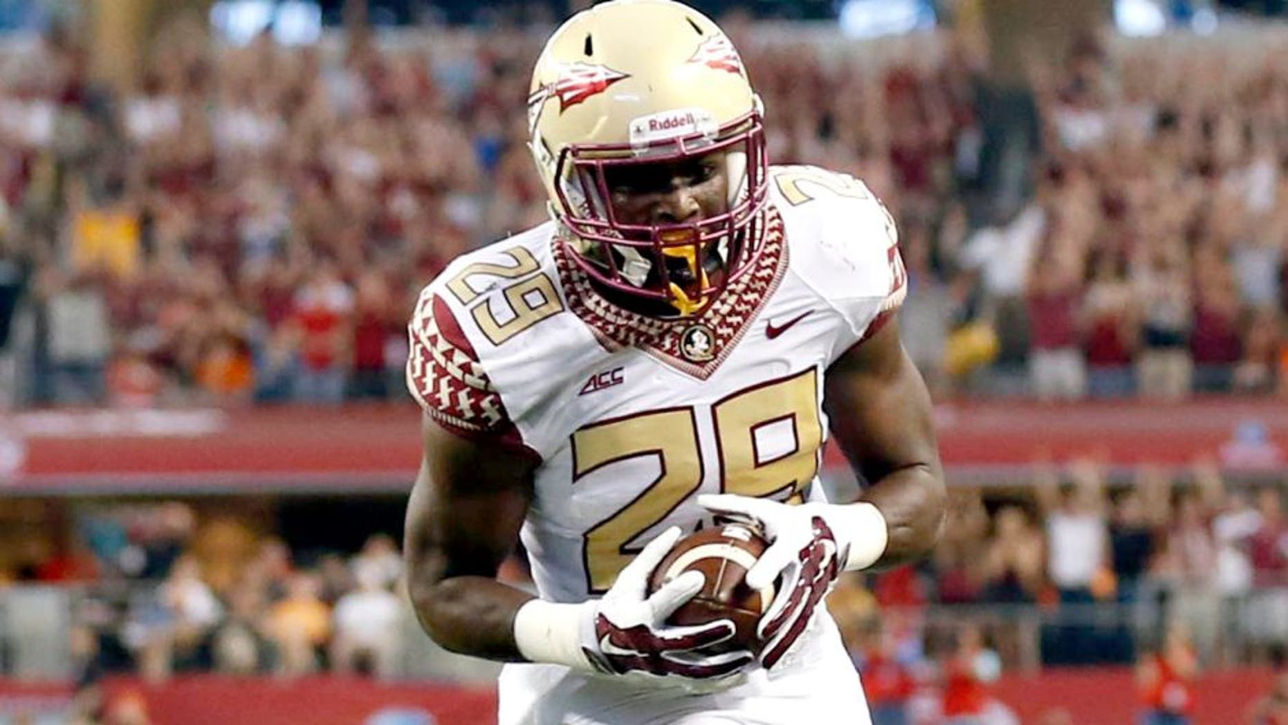 Aug 30, 2014; Arlington, TX, USA; Florida State Seminoles defensive back Nate Andrews (29) makes a touchdown run against the Oklahoma State Cowboys during the first quarter at AT&T Stadium. Mandatory Credit: Matthew Emmons-USA TODAY Sports