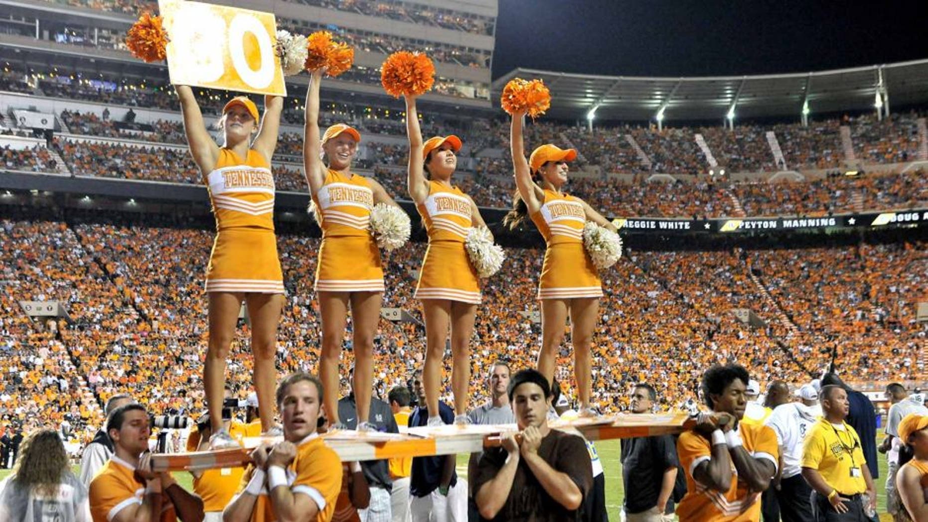 Aug 31, 2014; Knoxville, TN, USA; Tennessee Volunteers cheerleaders entertain fans during the first half against the Utah State Aggies at Neyland Stadium. Mandatory Credit: Jim Brown-USA TODAY Sports