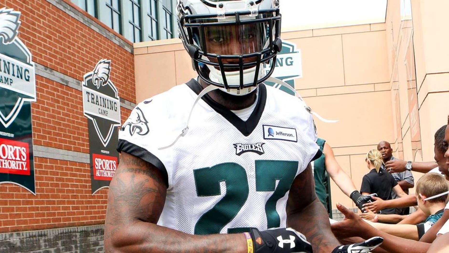 Jul 26, 2014; Philadelphia, PA, USA; Philadelphia Eagles free safety Malcolm Jenkins (27) is greeted by fans as he runs onto the field for the start of training camp at the Novacare Complex. Mandatory Credit: Bill Streicher-USA TODAY Sports