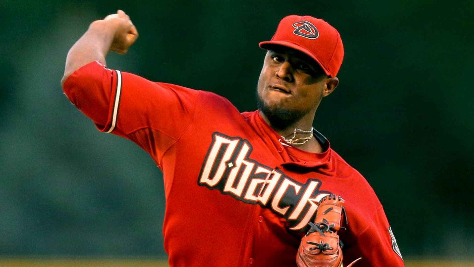 DENVER, CO - SEPTEMBER 1: Starting pitcher Rubby De La Rosa #12 of the Arizona Diamondbacks delivers to home plate during the first inning against the Colorado Rockies at Coors Field on September 1, 2015 in Denver, Colorado. (Photo by Justin Edmonds/Getty Images)