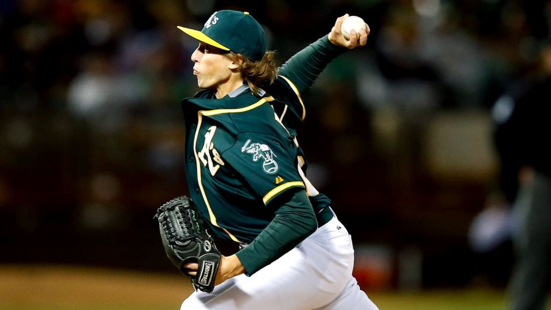 OAKLAND, CA - SEPTEMBER 01: Ryan Dull #66 of the Oakland Athletics pitches against the Los Angeles Angels of Anaheim in the eighth inning at O.co Coliseum on September 1, 2015 in Oakland, California. This was his Major League debut. (Photo by Ezra Shaw/Getty Images)