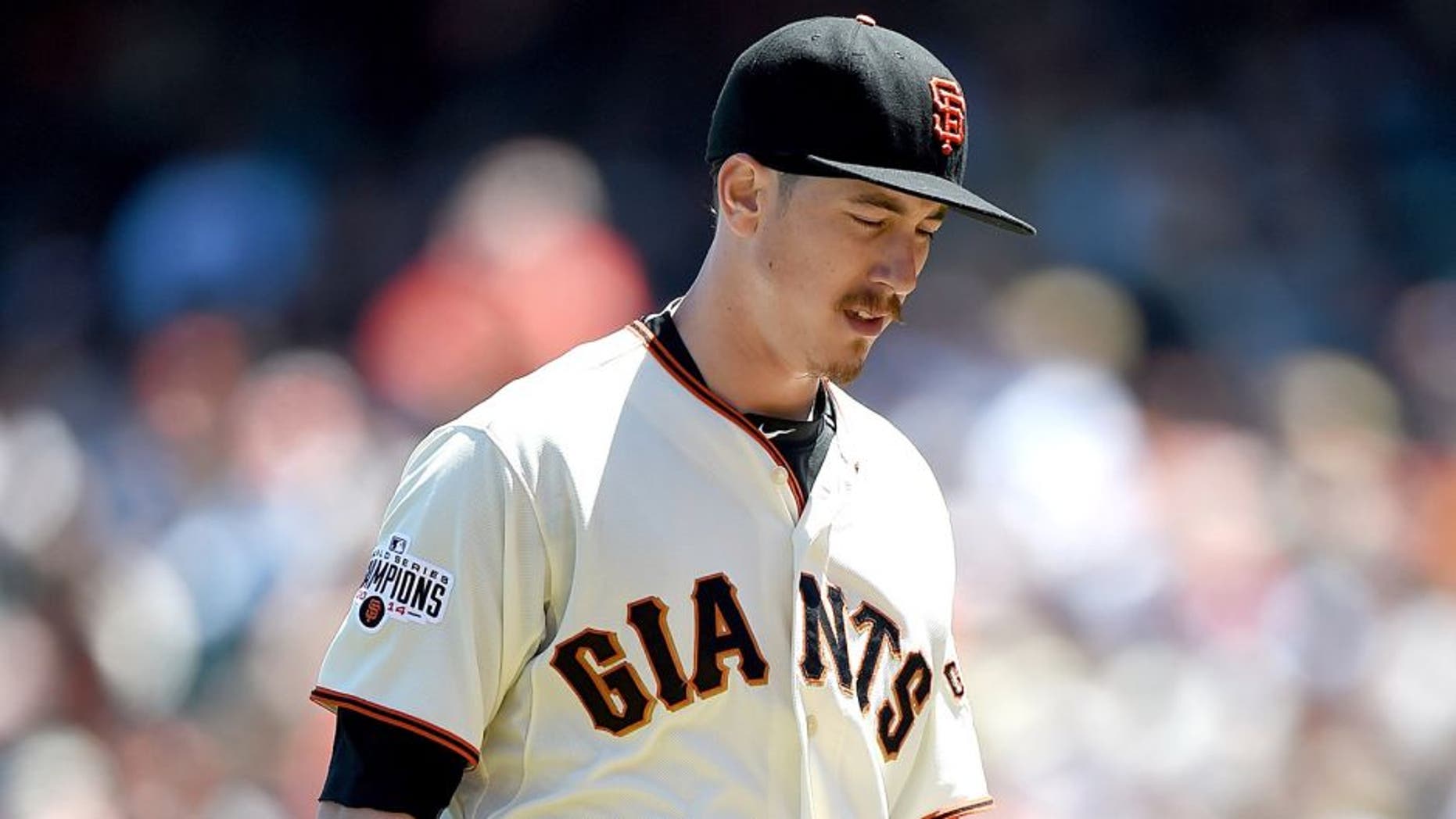 SAN FRANCISCO, CA - JUNE 16: Tim Lincecum #55 of the San Francisco Giants walks back to the dugout after he was taken out of th game against the Seattle Mariners in the top of the six inning at AT&T Park on June 16, 2015 in San Francisco, California. (Photo by Thearon W. Henderson/Getty Images)