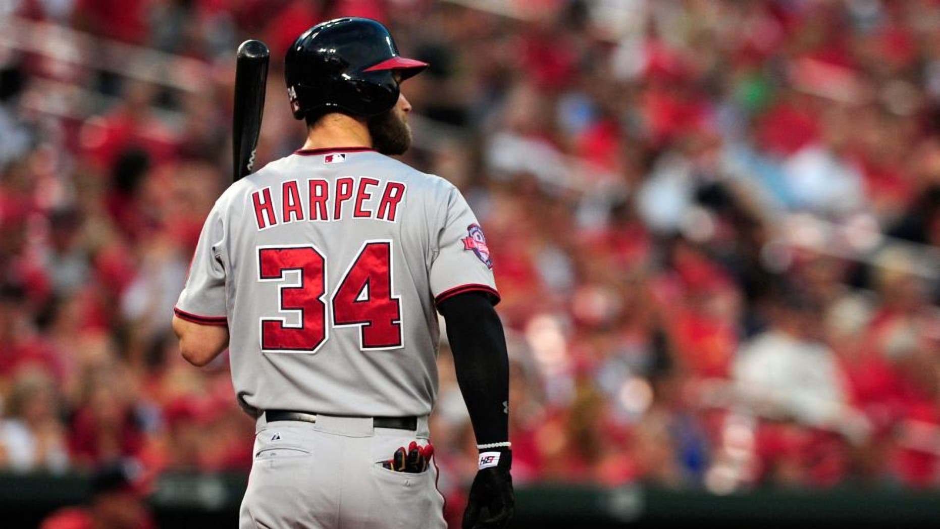 Sep 2, 2015; St. Louis, MO, USA; Washington Nationals right fielder Bryce Harper (34) walks back to the dugout after striking out during the first inning against the St. Louis Cardinals at Busch Stadium. The Nationals defeated the Cardinals 4-3. Mandatory Credit: Jeff Curry-USA TODAY Sports