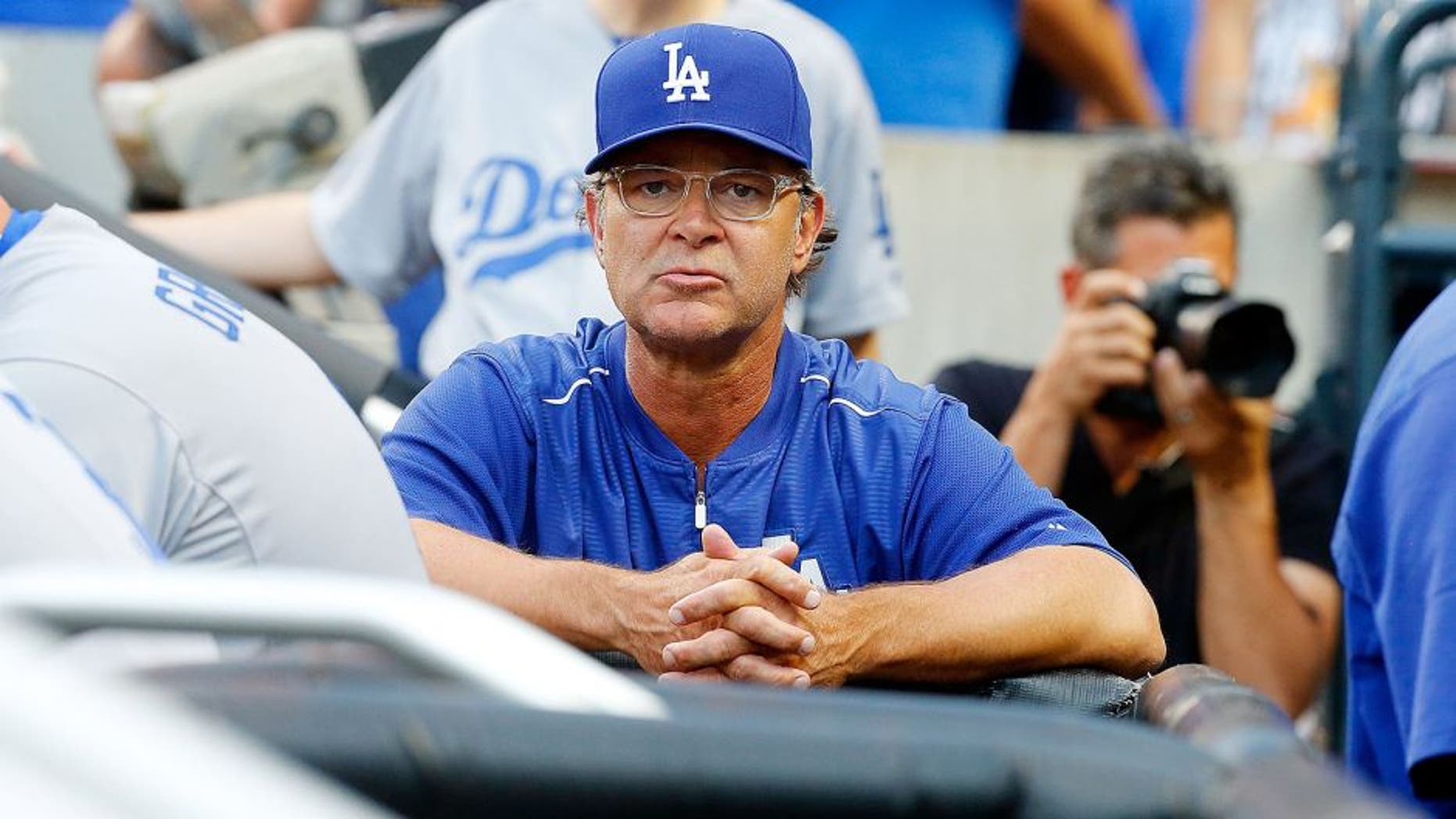 NEW YORK, NY - JULY 24: (NEW YORK DAILIES OUT) Manager Don Mattingly #8 of the Los Angeles Dodgers looks on against the New York Mets at Citi Field on July 24, 2015 in the Flushing neighborhood of the Queens borough of New York City. The Dodgers defeated the Mets 7-2. (Photo by Jim McIsaac/Getty Images)