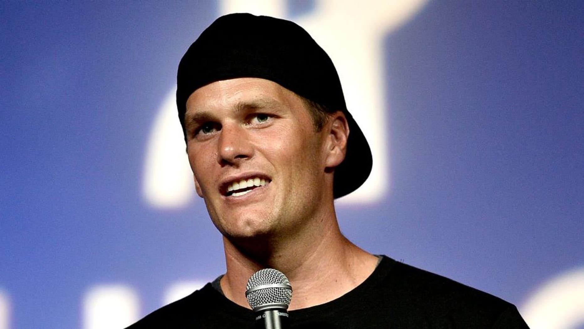ALLSTON, MA - MAY 29: NFL player and Best Buddies honorary co-chair Tom Brady speaks on stage during a Guy Fieri celebrity chef tailgate for the Best Buddies Challenge: Hyannis Port 2015 at Harvard Field on May 29, 2015 in Allston, Massachusetts. (Photo by Paul Marotta/Getty Images for Best Buddies)