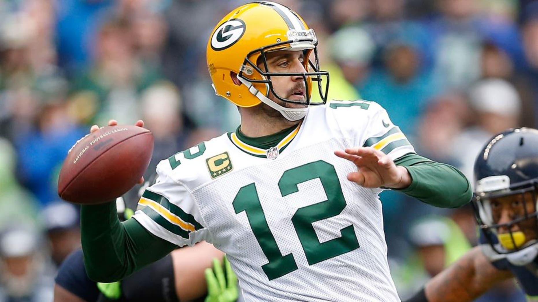 SEATTLE, WA - JANUARY 18: Quarterback Aaron Rodgers #12 of the Green Bay Packers in action during the 2015 NFC Championship game against the Seattle Seahawks at CenturyLink Field on January 18, 2015 in Seattle, Washington. The Seahawks defeated the Packers 28-22 in overtime. (Photo by Christian Petersen/Getty Images)