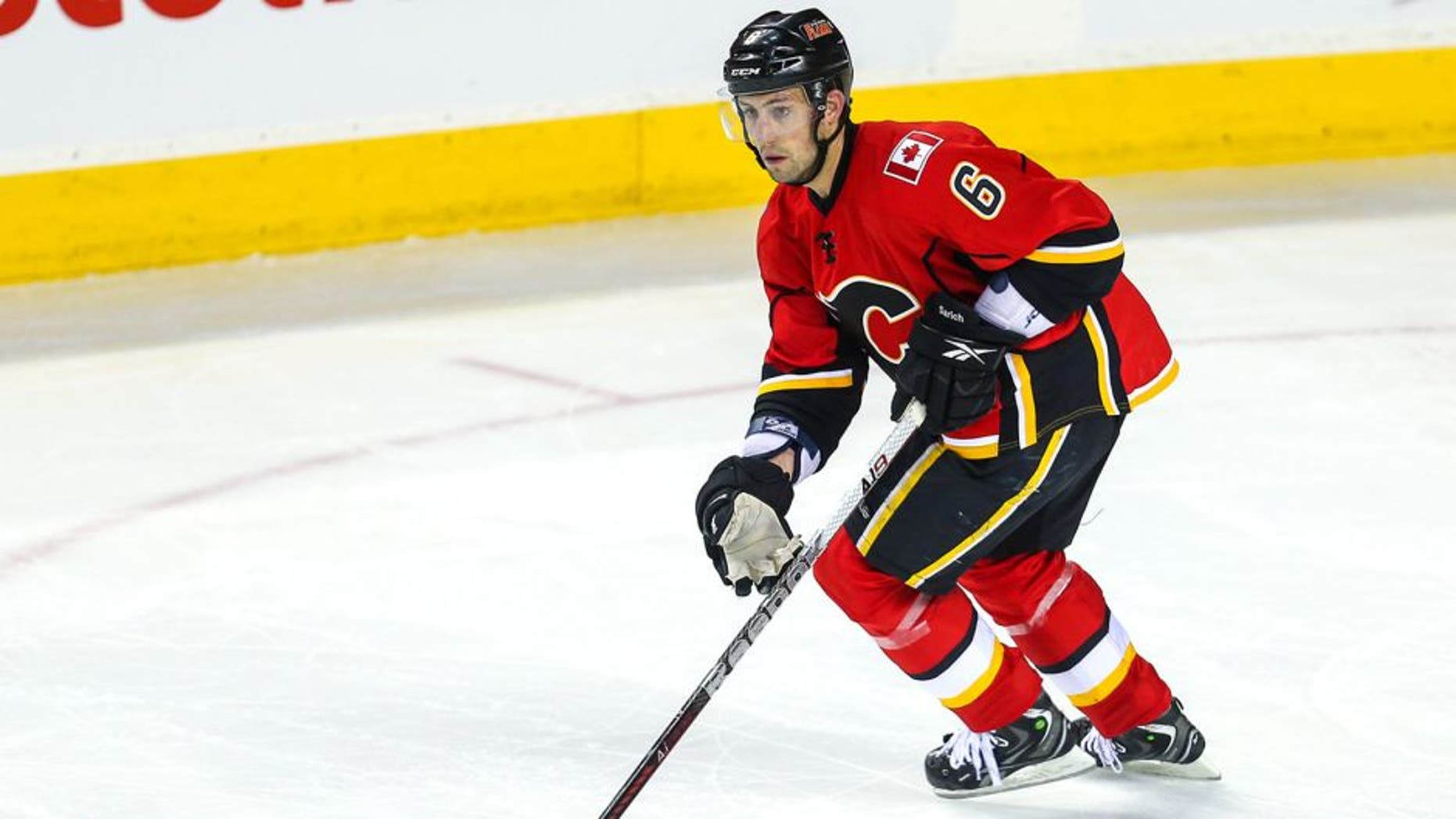 Apr 12, 2013; Calgary, Alberta, CAN; Calgary Flames defenseman Cory Sarich (6) skates with the puck against the Phoenix Coyotes during the third period at the Scotiabank Saddledome. Calgary Flames won 3-2. Mandatory Credit: Sergei Belski-USA TODAY Sports