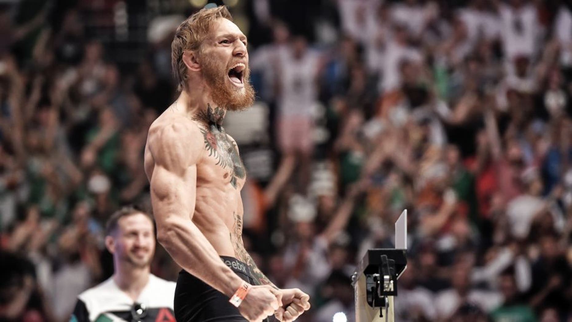 LAS VEGAS, NV - JULY 10: UFC featherweight Conor 'The Notorious' McGregor of Ireland interacts with the crowd during the UFC 189 weigh-in at the MGM Grand Garden Arena on July 10, 2015 in Las Vegas, Nevada. (Photo by Jeff Bottari/Zuffa LLC/Zuffa LLC via Getty Images)