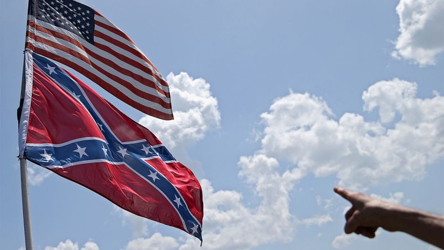 DAYTONA BEACH, FL - JULY 03: An American and a Confederate flag are seen during practice for the NASCAR Sprint Cup Series Coke Zero 400 at Daytona International Speedway on July 3, 2015 in Daytona Beach, Florida. (Photo by Patrick Smith/Getty Images)