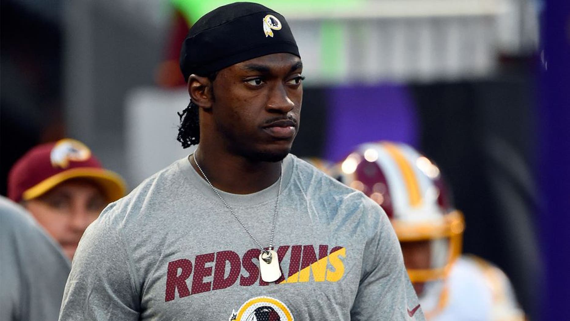 Aug 29, 2015; Baltimore, MD, USA; Washington Redskins quarterback Robert Griffin III (10) walks on to the field with his teammates before the game against the Baltimore Ravens at M&T Bank Stadium. Mandatory Credit: Tommy Gilligan-USA TODAY Sports