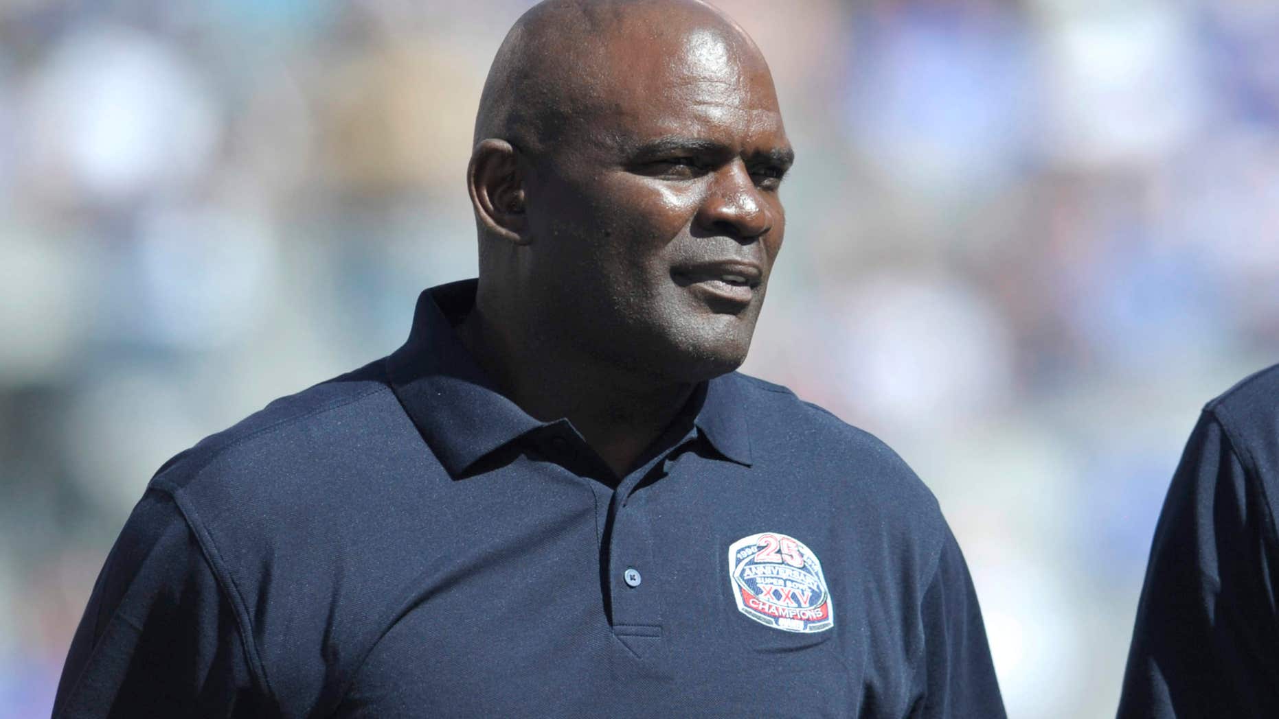 In this Sept. 20, 2015, photo, former New York Giants' Lawrence Taylor looks on during a 25 year anniversary celebration at halftime of an NFL football game against the Atlanta Falcons in East Rutherford, N.J.