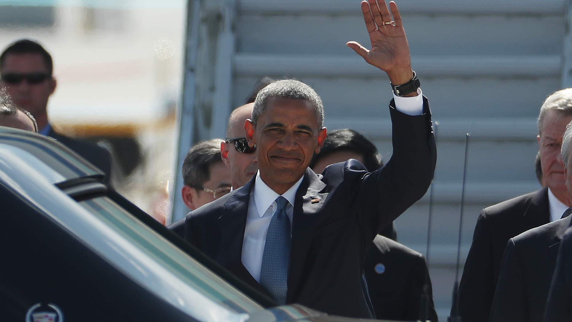U.S. President Barack Obama waves has he arrives at the Hangzhou Xiaoshan International Airport, Saturday, Sept. 3, 2016, in Hangzhou, China, to attend the G-20 summit.