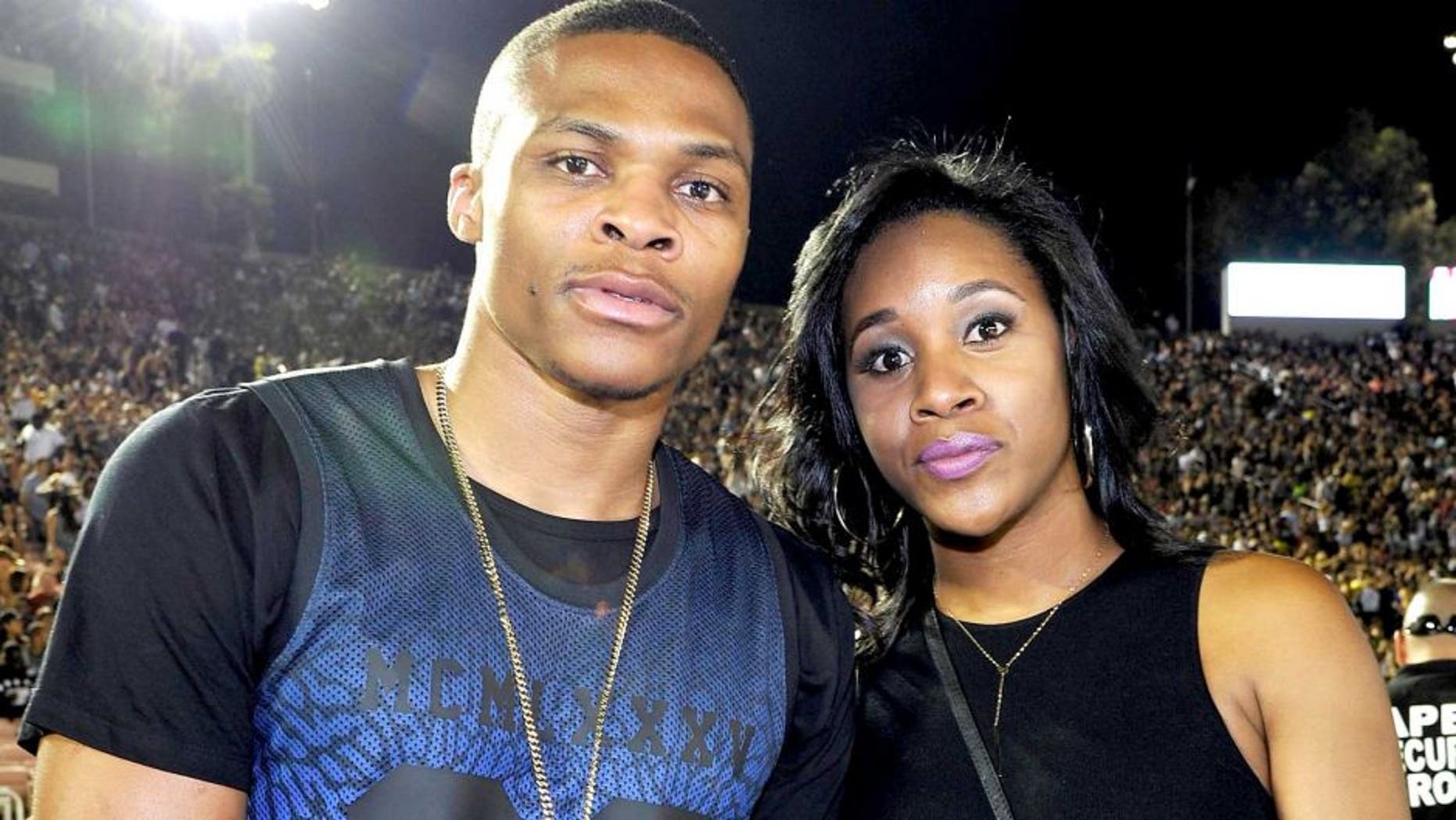 PASADENA, CA - AUGUST 02: (L-R) Russell Westbrook and Nina Earl attend D'USSE VIP riser and lounge at "On The Run Tour" at Rose Bowl on August 2, 2014 in Pasadena, California. (Photo by John Sciulli/Getty Images for D'USSE)