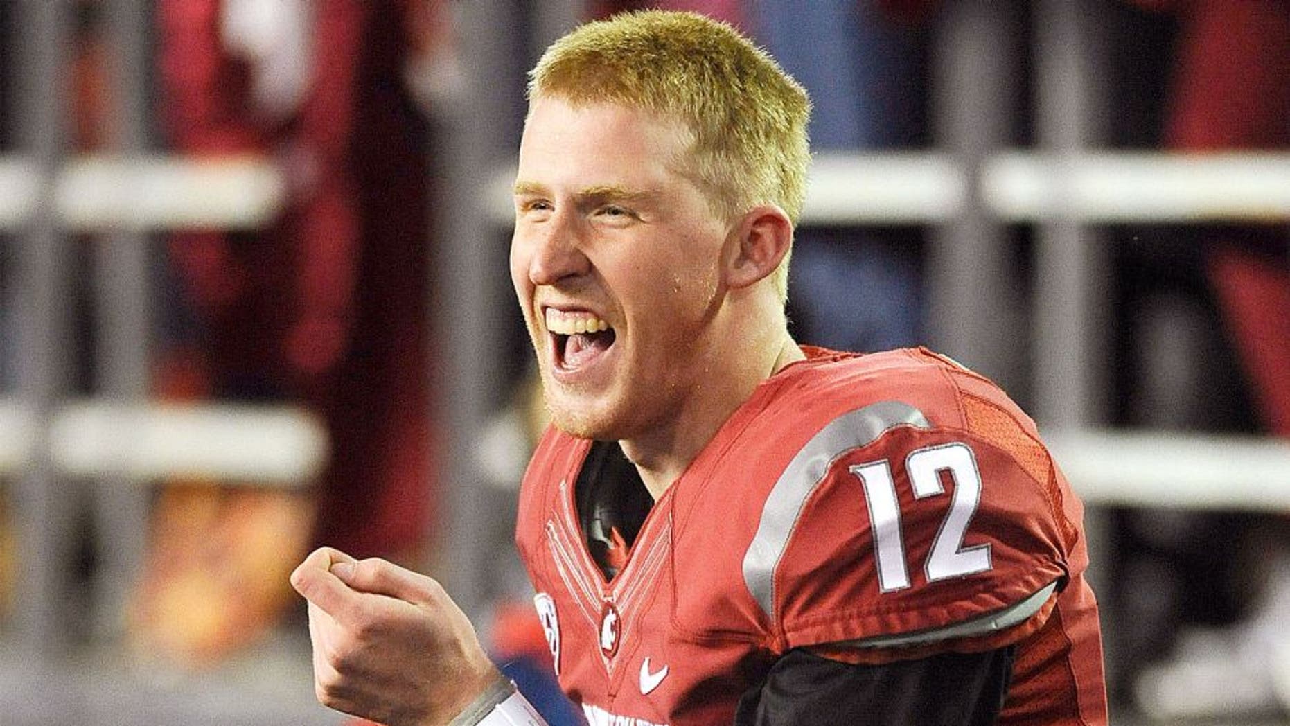 Oct 12, 2013; Pullman, WA, USA; Washington State Cougars quarterback Connor Halliday (12) reacts during the second half against the Oregon State Beavers at Martin Stadium. The Beavers beat the Cougars 52-24. Mandatory Credit: James Snook-USA TODAY Sports