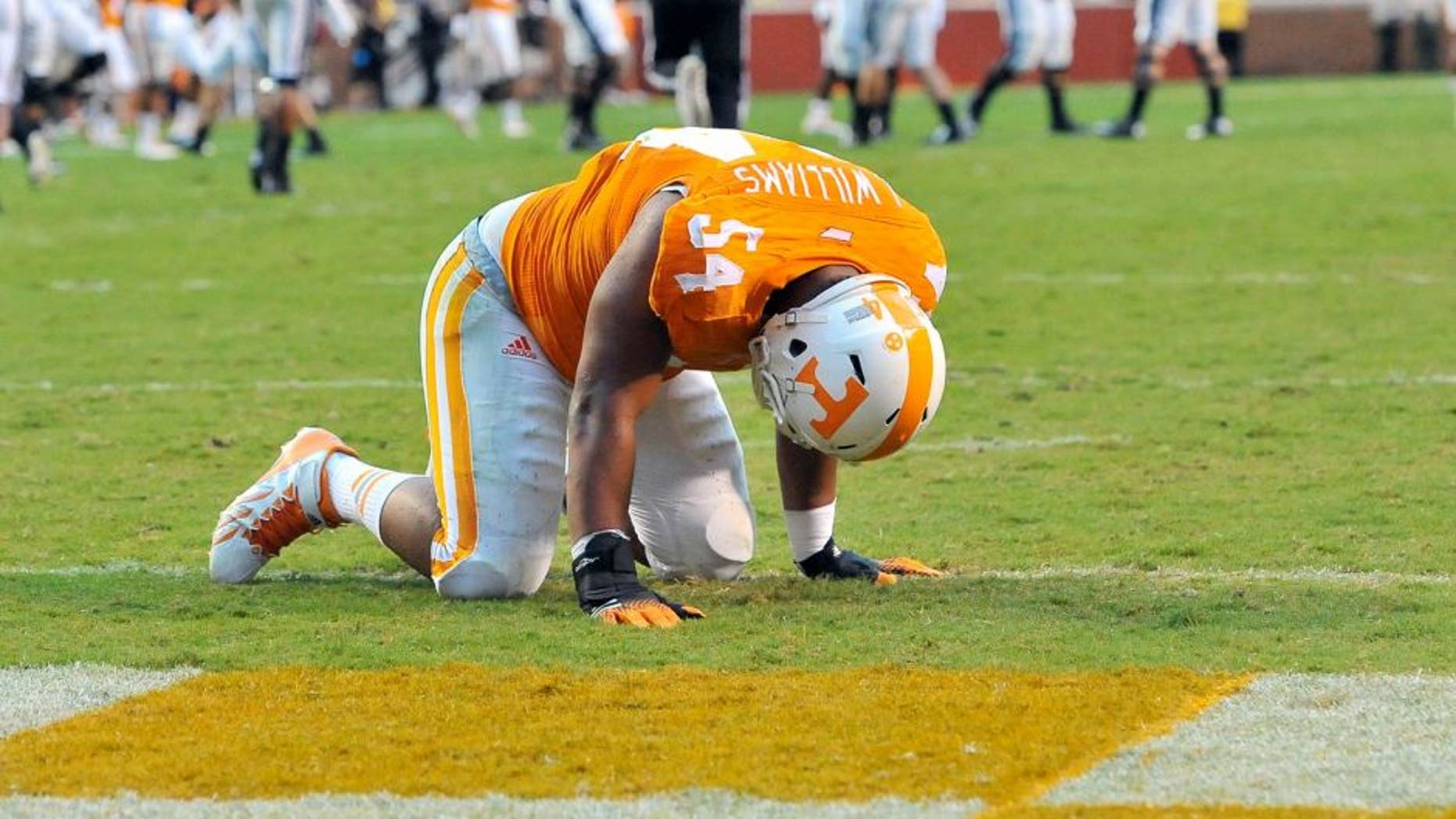 Aug 31, 2014; Knoxville, TN, USA; Tennessee Volunteers defensive lineman Jordan Williams (54) is shaken up on a play against the Utah State Aggies during the first half at Neyland Stadium. Mandatory Credit: Jim Brown-USA TODAY Sports