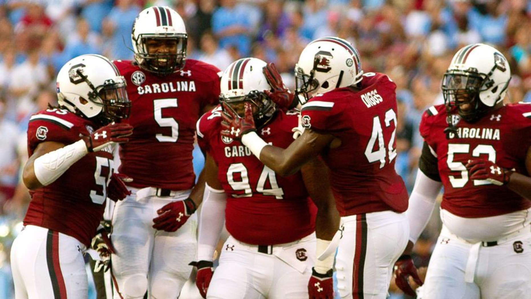 Sep 3, 2015; Charlotte, NC, USA; South Carolina Gamecocks defensive tackle Kelsey Griffin (94) celebrates with teammates during the second quarter against the North Carolina Tar Heels at Bank of America Stadium. Mandatory Credit: Joshua S. Kelly-USA TODAY Sports