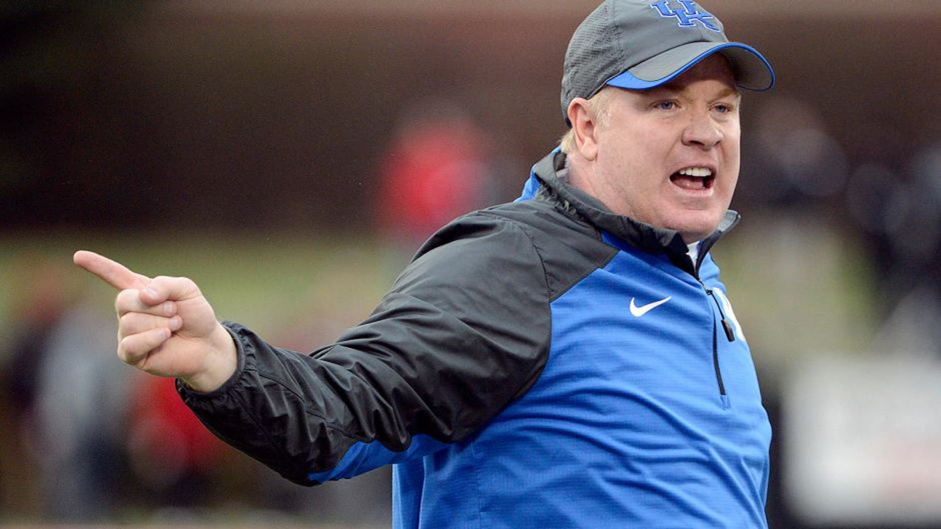 Nov 29, 2014; Louisville, KY, USA; Kentucky Wildcats head coach Mark Stoops reacts during the second half against the Louisville Cardinals at Papa John's Cardinal Stadium. Louisville defeated Kentucky 44-40. Mandatory Credit: Jamie Rhodes-USA TODAY Sports