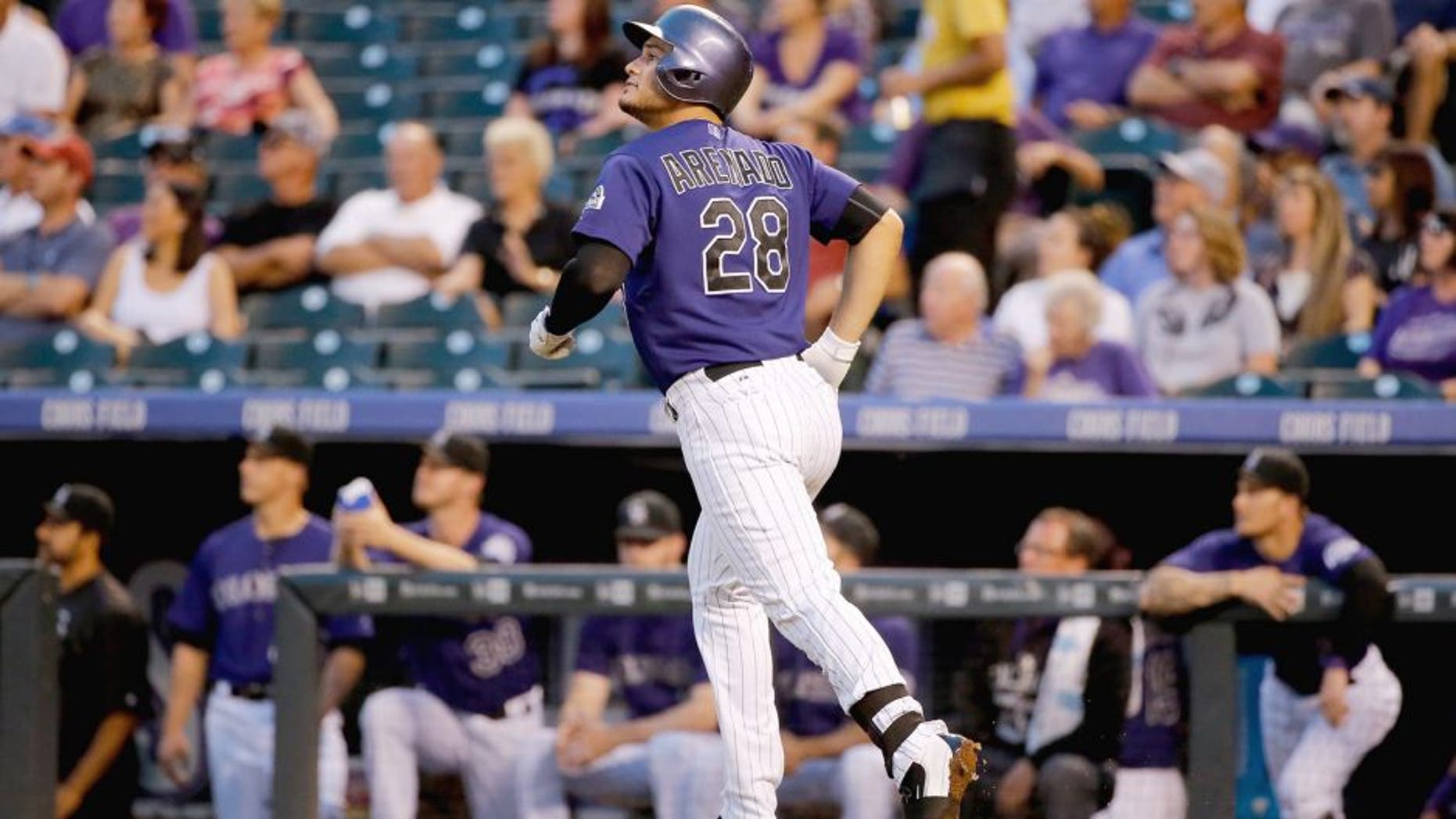 DENVER, CO - SEPTEMBER 02: Nolan Arenado #28 of the Colorado Rockies watches his two run home run off of Chase Anderson #57 of the Arizona Diamondbacks to give the Rockies a 3-1 lead in the first inning at Coors Field on September 2, 2015 in Denver, Colorado. (Photo by Doug Pensinger/Getty Images)