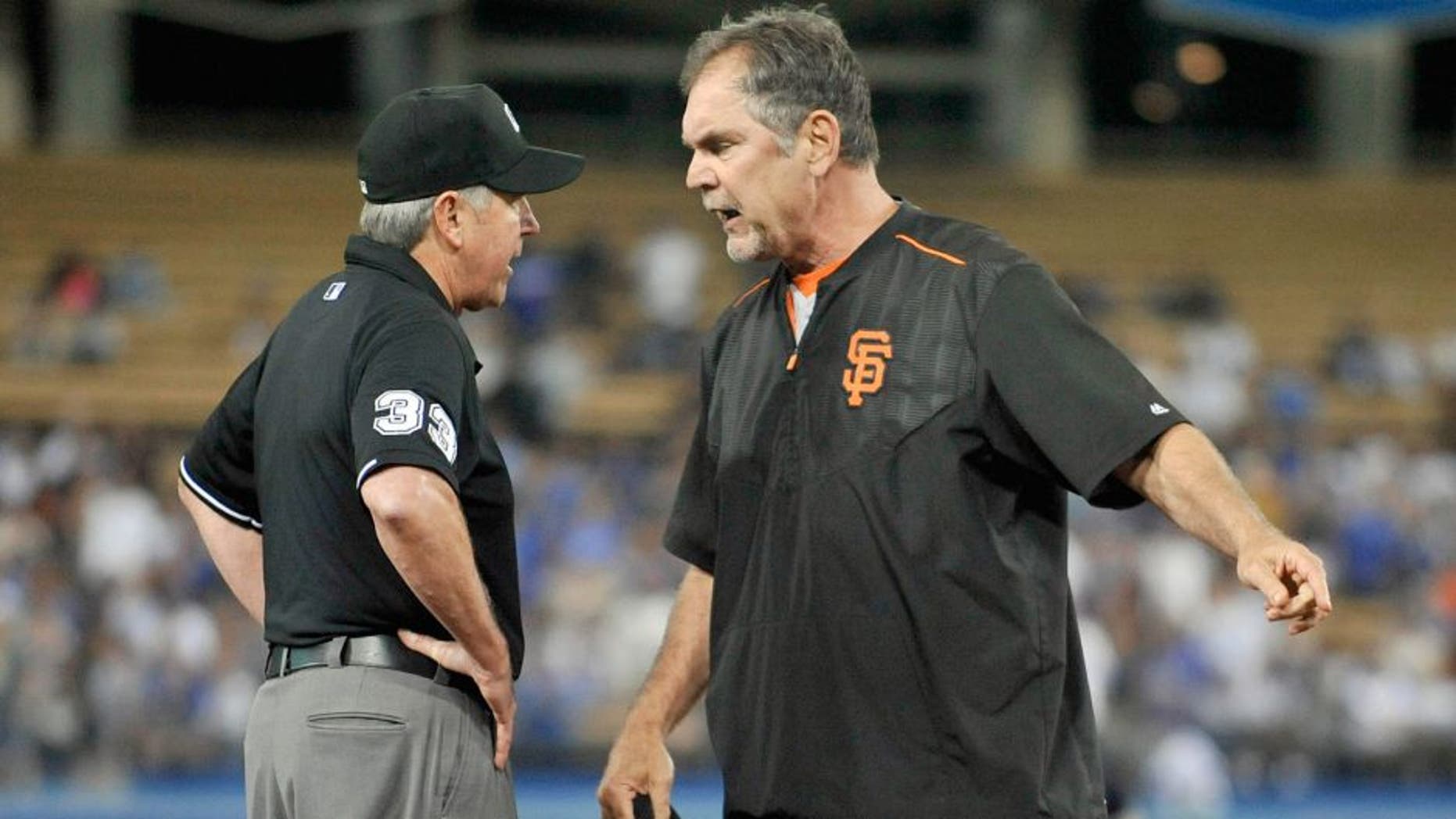 September 2, 2015; Los Angeles, CA, USA; San Francisco Giants manager Bruce Bochy (15) argues a call with umpire Mike Winters in the eighth inning at Dodger Stadium. Mandatory Credit: Gary A. Vasquez-USA TODAY Sports