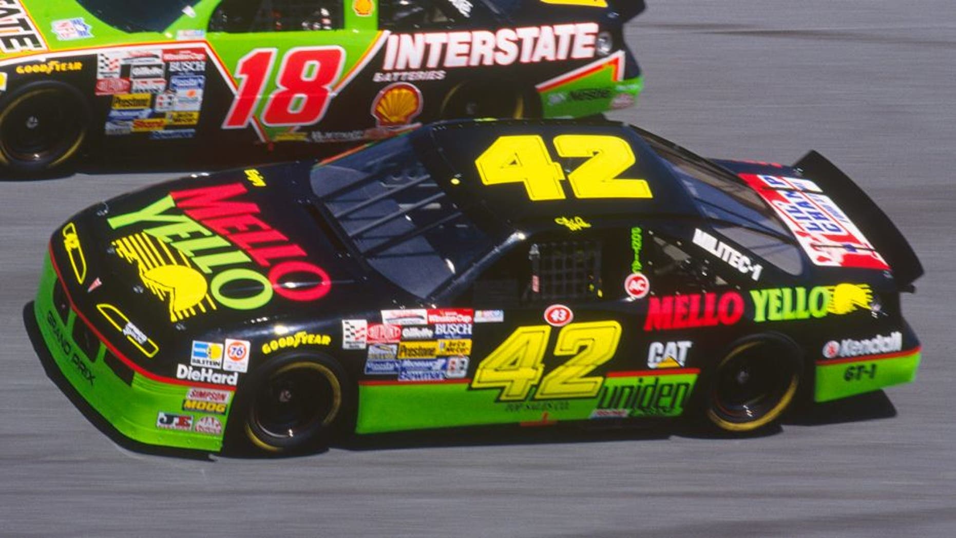 Dale Jarrett drives his Interstate Batteries #18 car down a turn against Kyle Petty in his Mello Yello #42 car during the Daytona 500 at the Daytona Speedway on February 14, 1993 in Daytona Beach, Florida. (Photo by Focus on Sport/Getty Images)