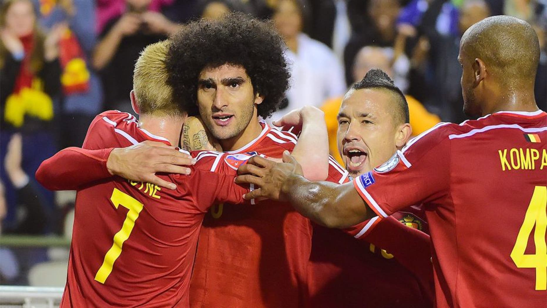 Belgium's Marouane Fellaini (2ndL) celebrates after scoring during the Euro 2016 qualifying match between Belgium and Bosnia and Herzegovina at the King Baudouin Stadium in Brussels, on September 3, 2015. AFP PHOTO / EMMANUEL DUNAND (Photo credit should read EMMANUEL DUNAND/AFP/Getty Images)