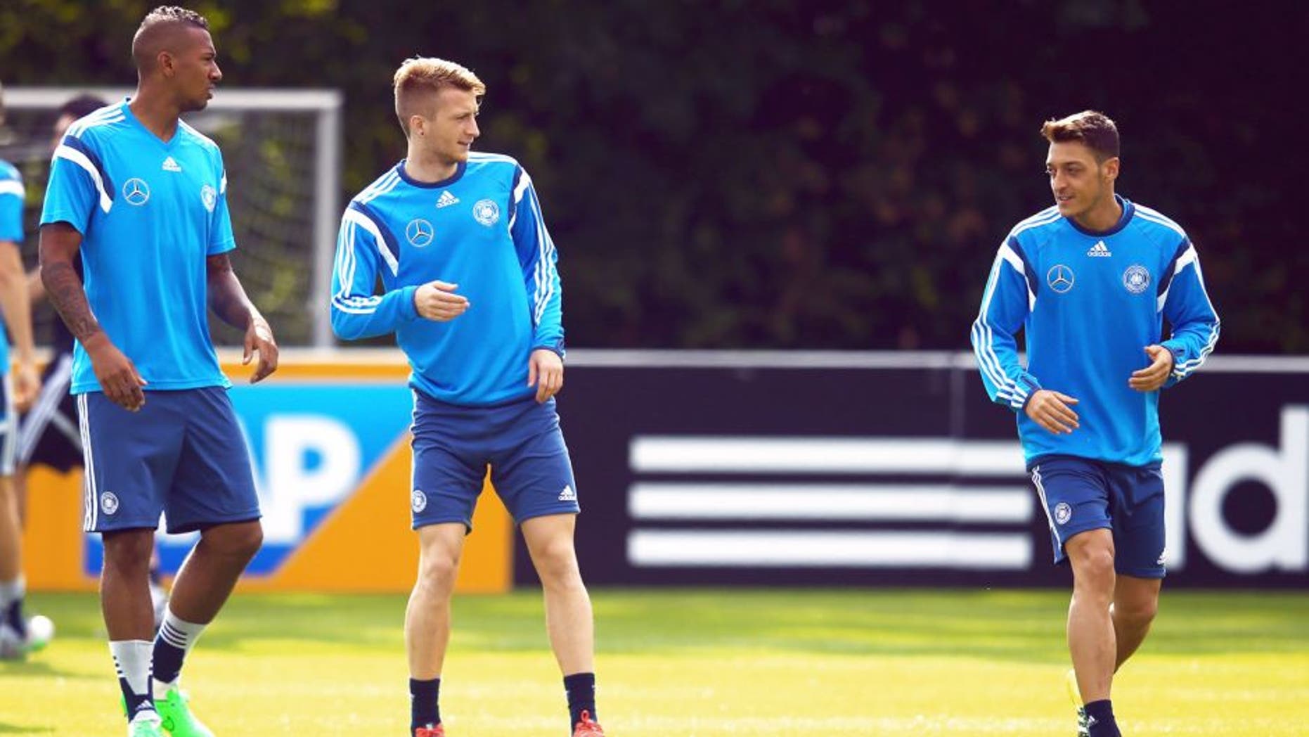 FRANKFURT AM MAIN, GERMANY - SEPTEMBER 02: Jerome Boateng, Marco Reus and Mesut Oezil (L-R) attend a Germany training session at 'Kleine Kampfbahn' training ground on September 2, 2015 in Frankfurt am Main, Germany. (Photo by Alex Grimm/Bongarts/Getty Images)