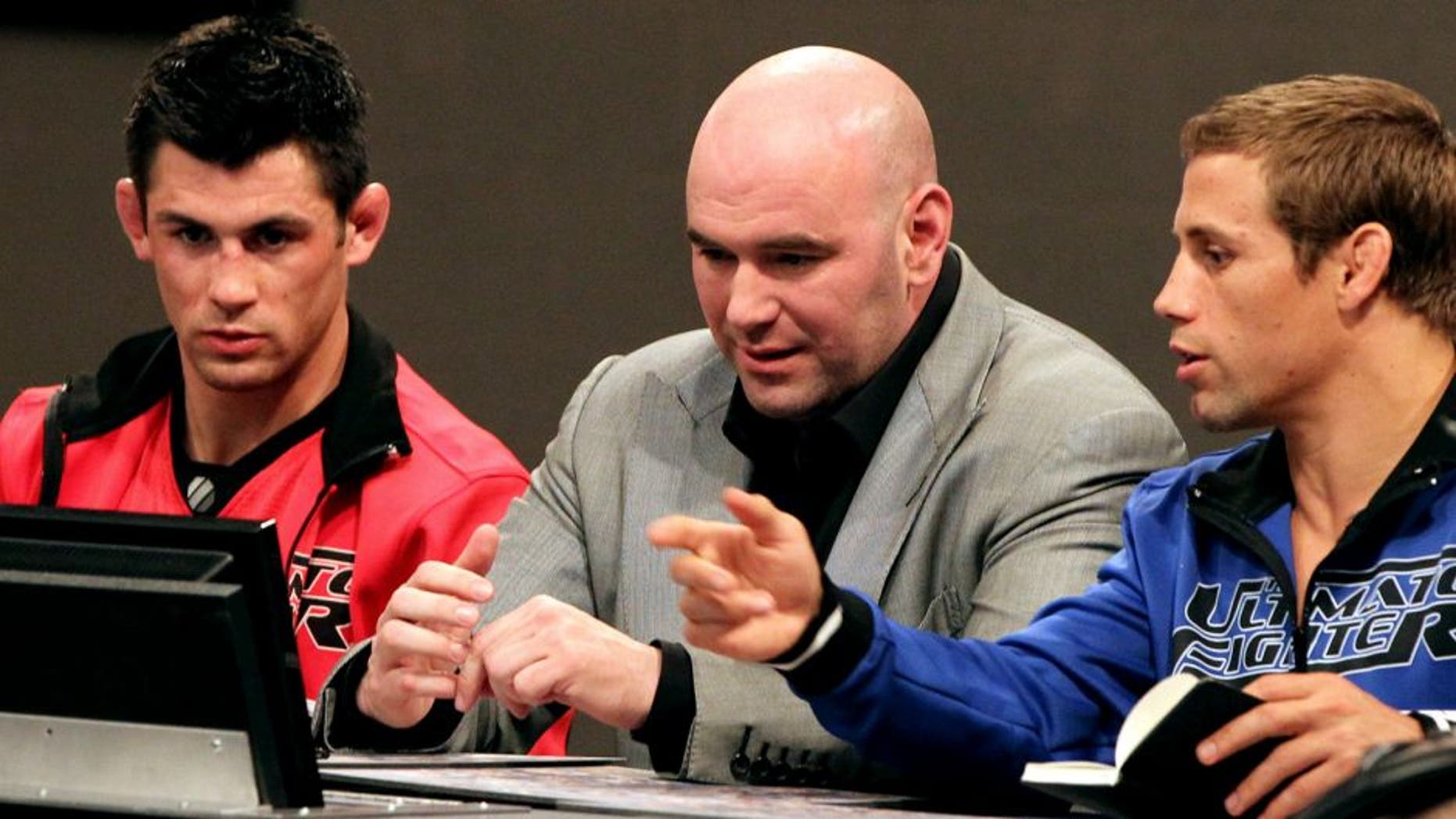 LAS VEGAS, NV - MARCH 09: TUF coaches Urijah Faber (R) and Dominick Cruz (L) analyze fights with UFC President Dana White during the first episode of The Ultimate Fighter Live at the Ultimate Fighter Gym on March 9, 2012 in Las Vegas, Nevada. (Photo by Josh Hedges/Zuffa LLC/Zuffa LLC via Getty Images)