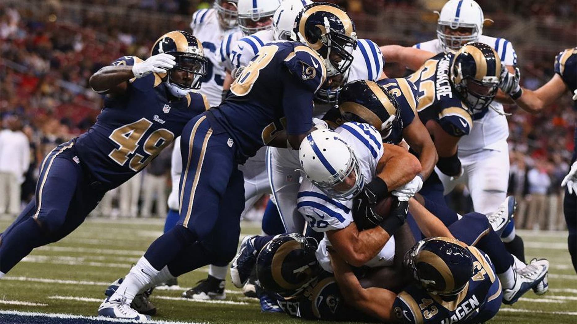 ST. LOUIS, MO - AUGUST 29: Tyler Varga #38 of the Indianapolis Colts scores a touchdown against the St. Louis Rams in the fourth quarter during a preseason game at the Edward Jones Dome on August 29, 2014 in St. Louis, Missouri. (Photo by Dilip Vishwanat/Getty Images)