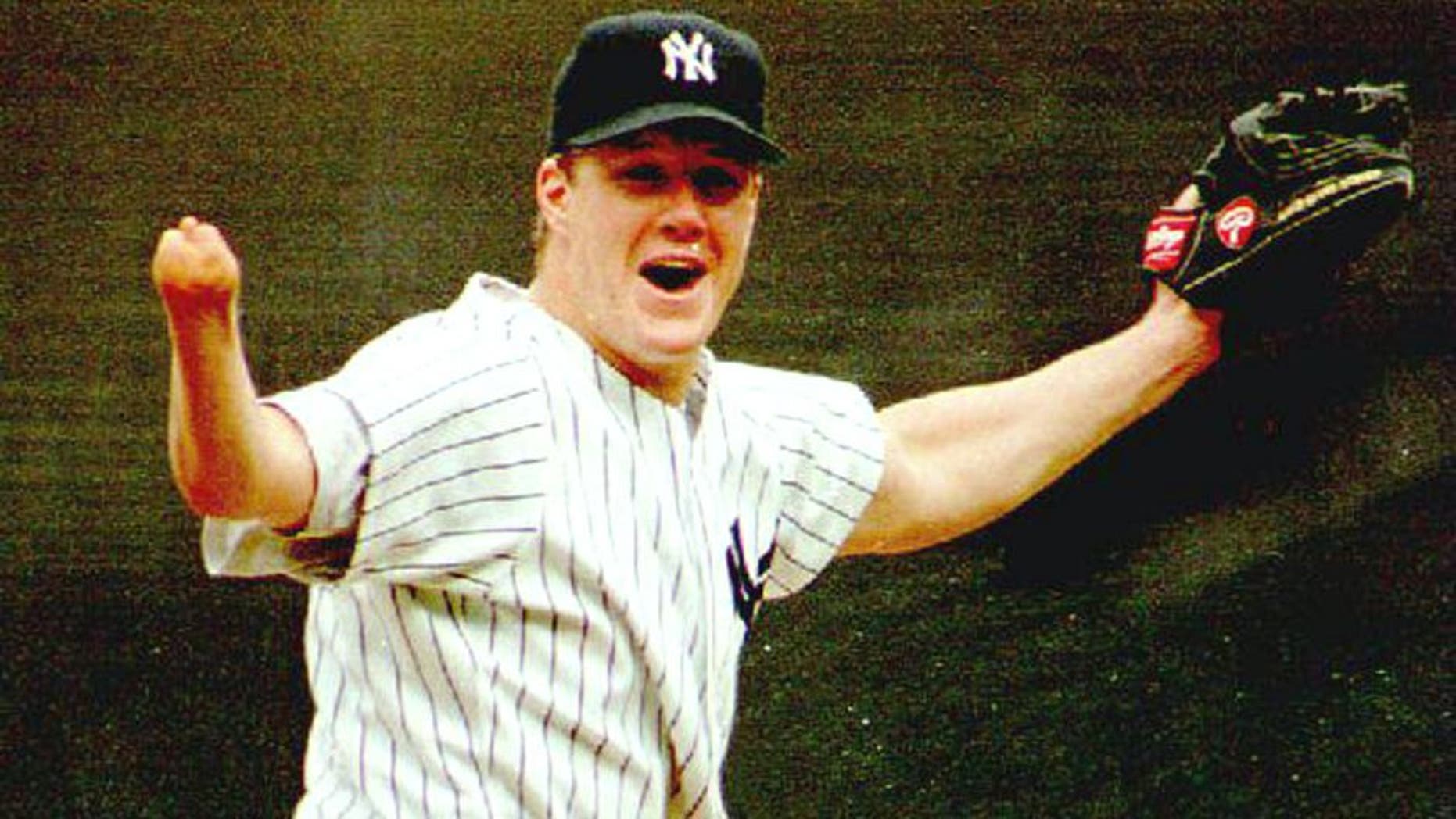 NEW YORK, NY - SEPTEMBER 4: New York Yankees pitcher Jim Abbott celebrates after the last out of New York's first no-hitter in 10 years 04 September 1993. Abbott, who was born without a right hand, walked five and struck out three as the Yankees defeated the Cleveland Indians 4-0. (Photo credit should read MARK D. PHILLIPS/AFP/Getty Images)