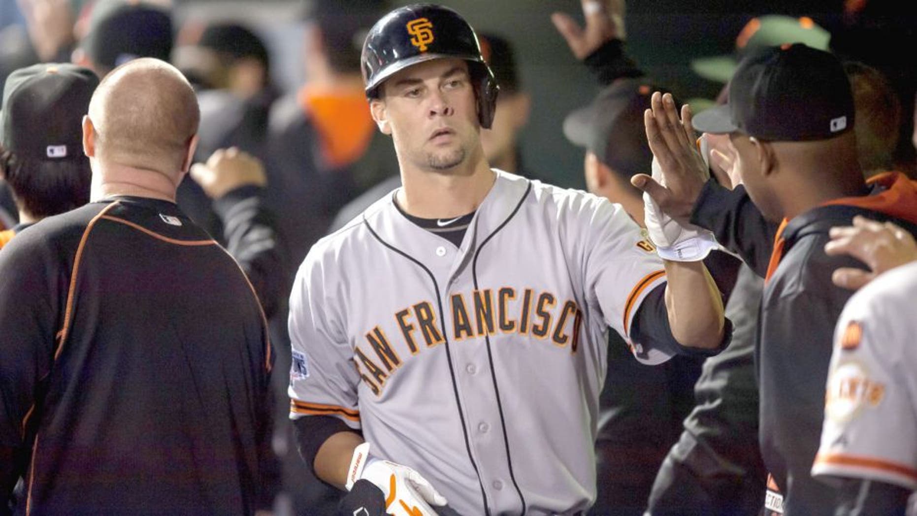 DENVER, CO - SEPTEMBER 3: Ryan Vogelsong #32 of the San Francisco Giants in the dugout after hitting his first career home run in the fourth inning of a game at Coors Field on September 3, 2015 in Denver, Colorado. (Photo by Dustin Bradford/Getty Images)