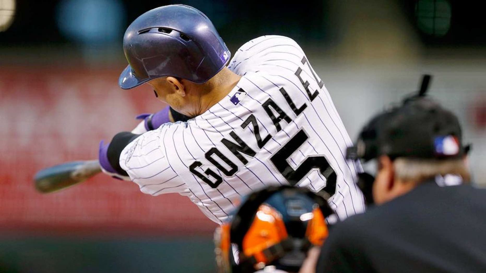Colorado Rockies' Carlos Gonzalez connects for a solo home run off San Francisco Giants starting pitcher Chris Heston in the first inning of a baseball game Friday, Sept. 4, 2015, in Denver. (AP Photo/David Zalubowski)