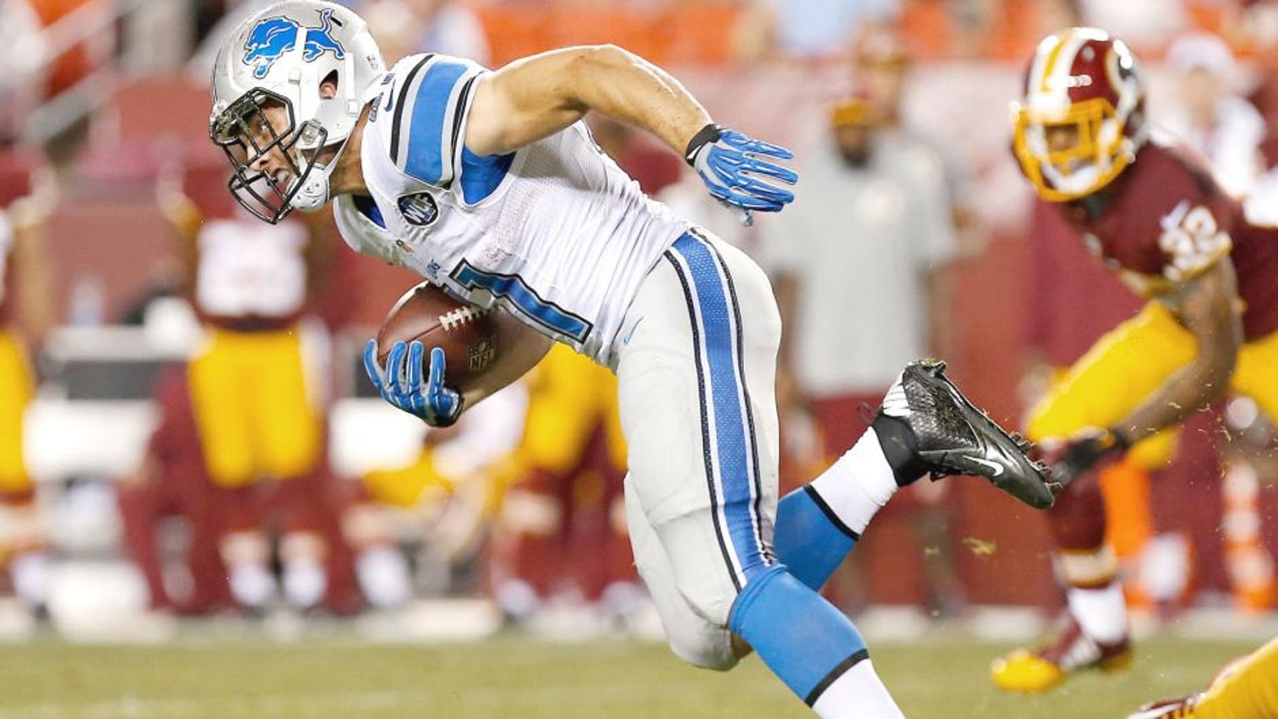 Aug 20, 2015; Landover, MD, USA; Detroit Lions running back Zach Zenner (41) carries the ball against the Washington Redskins at FedEx Field. Mandatory Credit: Geoff Burke-USA TODAY Sports