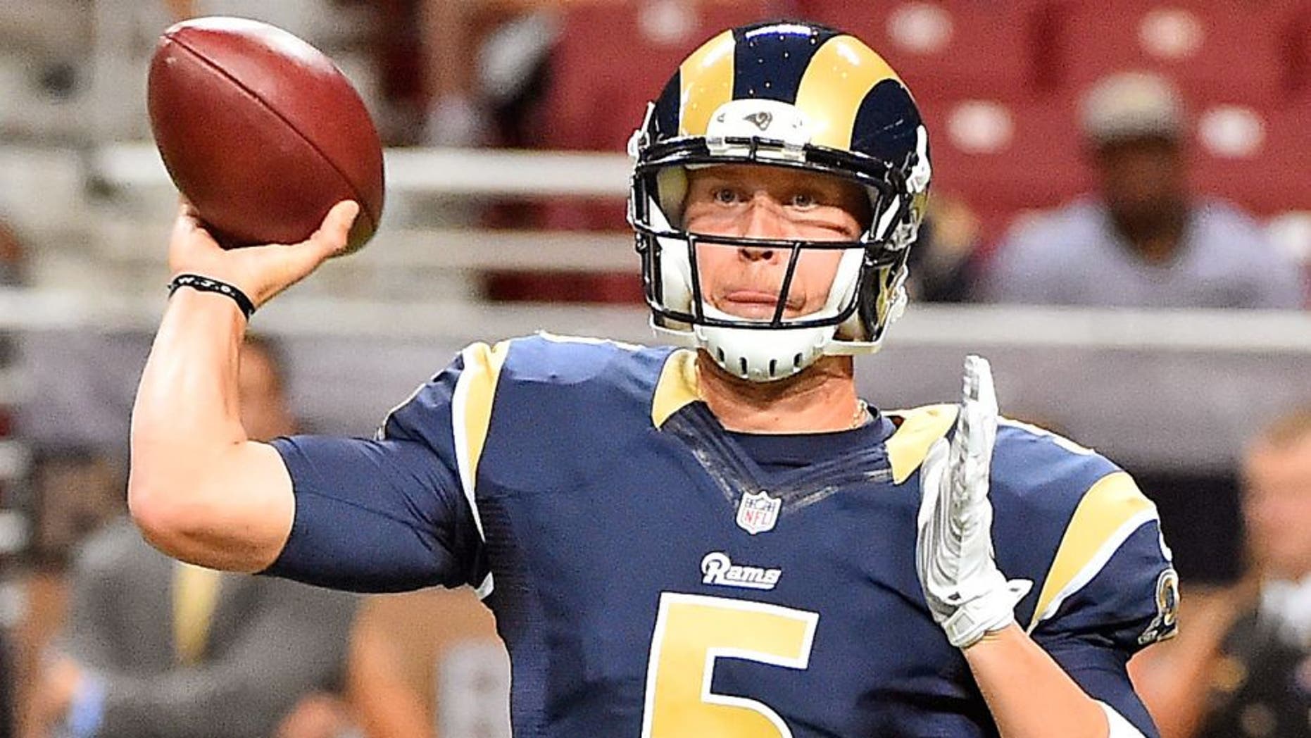 Sep 3, 2015; St. Louis, MO, USA; St. Louis Rams quarterback Nick Foles (5) attempts to pass the ball against the Kansas City Chiefs during the first half at the Edward Jones Dome. Mandatory Credit: Jasen Vinlove-USA TODAY Sports