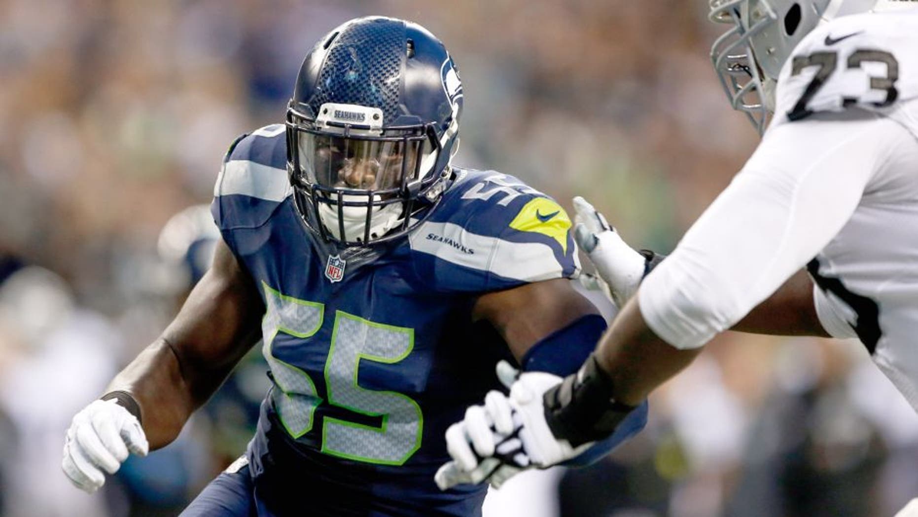 Sep 3, 2015; Seattle, WA, USA; Seattle Seahawks defensive end Frank Clark (55) rushes the passer against the Oakland Raiders during the second quarter at CenturyLink Field. Mandatory Credit: Joe Nicholson-USA TODAY Sports