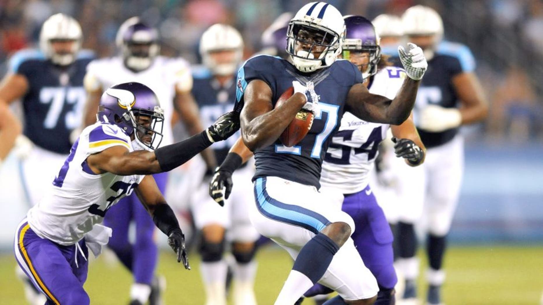 Sep 3, 2015; Nashville, TN, USA; Tennessee Titans receiver Dorial Green-Beckham (17) is tackled after a catch during the first half against the Minnesota Vikings at Nissan Stadium. Mandatory Credit: Christopher Hanewinckel-USA TODAY Sports
