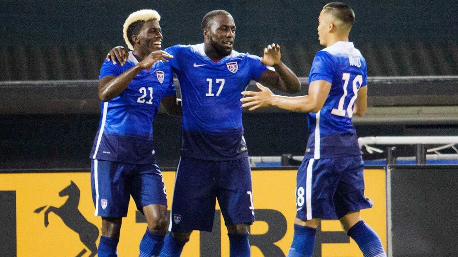 U.S. forward Jozy Altidore (17) celebrates his second goal with teammates forwards Gyasi Zardes (21) and Bobby Wood (18) during the second half of an international friendly soccer match against Peru, Friday, Sept. 4, 2015 at RFK Stadium in Washington. (AP Photo/Pablo Martinez Monsivais)