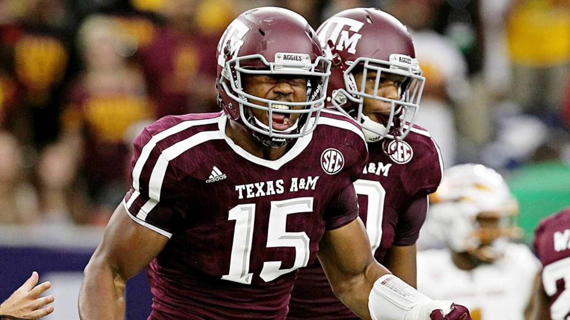 Sep 5, 2015; Houston, TX, USA; Texas A&M Aggies defensive lineman Myles Garrett (15) celebrates his sack against Arizona State Sun Devils quarterback Mike Bercovici (2) (not pictured)in the first quarter at NRG Stadium. Mandatory Credit: Thomas B. Shea-USA TODAY Sports