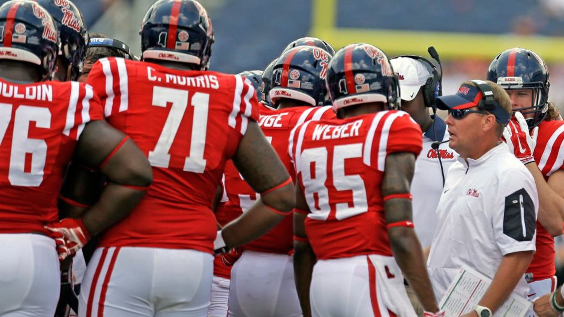 OXFORD MS -SEPTEMBER 5: Coach Hugh Freeze of the Mississippi Rebels talks to players during the second half of a NCAA college football game against the Tennessee Martin Skyhawks at Vaught-Hemingway Stadium on September 5, 2015 in Oxford, Mississippi. (Photo by Butch Dill/Getty Images)