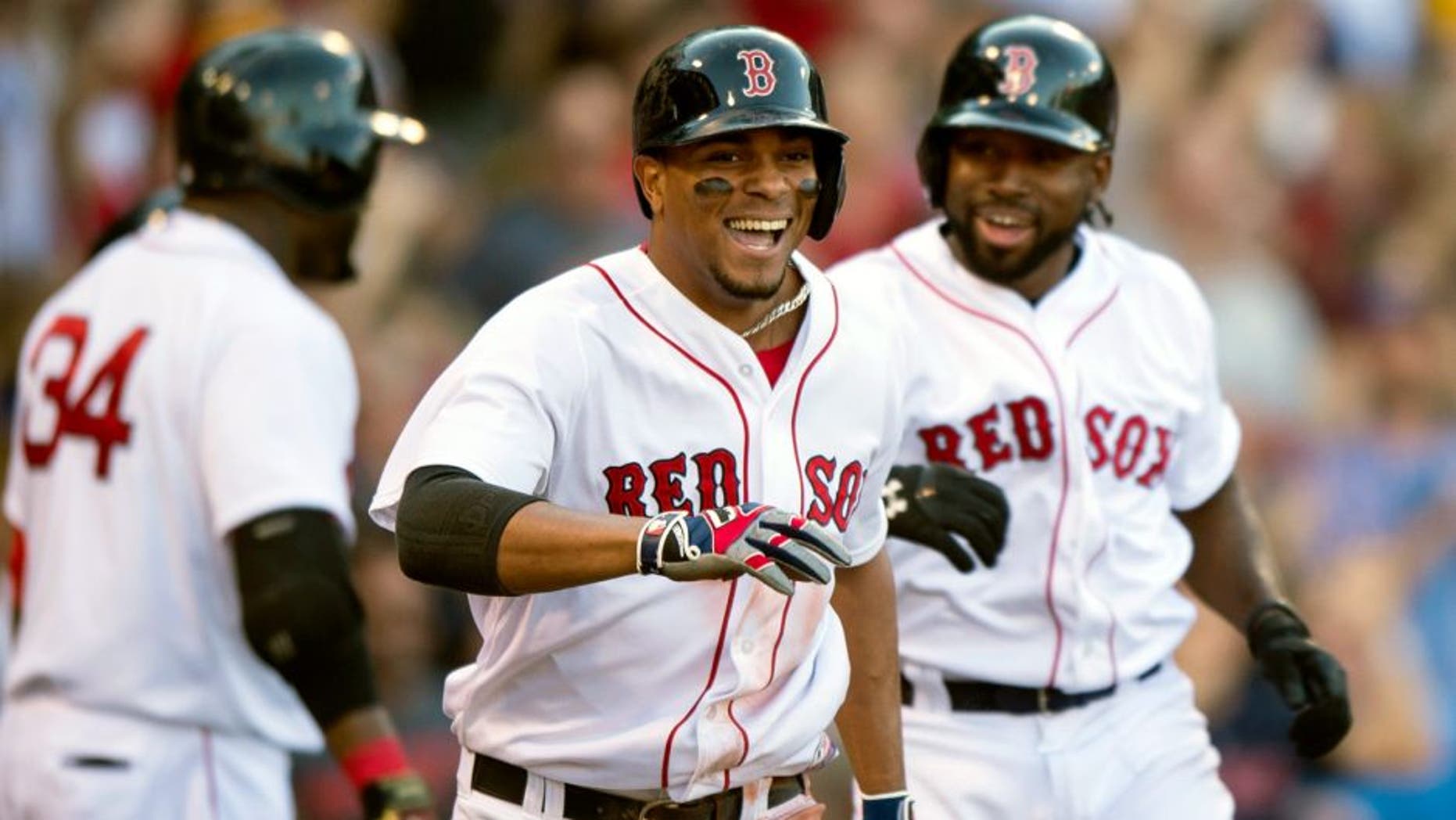 BOSTON, MA - SEPTEMBER 5: Xander Bogaerts #2 of the Boston Red Sox reacts after hitting a bases clearing triple and then scoring on a throwing error during the fourth inning against the Philadelphia Phillies at Fenway Park on September 5, 2015 in Boston, Massachusetts. (Photo by Michael Ivins/Boston Red Sox/Getty Images)
